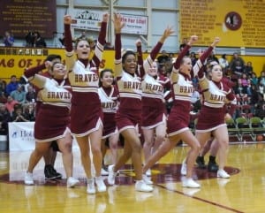 The Mt. Edgecumbe Cheerleaders leave the floor at halftime in 2013. (KCAW Photo/Robert Woolsey)