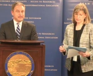 Gov. Sean Parnell signs budget bills in Anchorage Tuesday as Budget Director Karen Rehfeld handles paperwork.