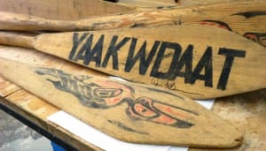 Some of the once-lost Yakutat cedar canoe paddles site on a workbench in the town's high school shop.