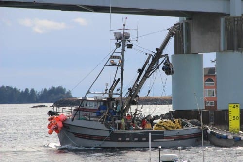 A seiner crosses beneath O'Connell Bridge during a day off in the 2014 Sitka Sound sac roe herring fishery (KCAW photo/Rachel Waldholz)