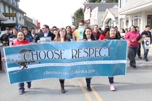 From left: Mt. Edgecumbe High School senior Kayleen Teeluk, Sitka High School sophomore Mackenzie Whitson, and Mt. Edgecumbe juniors Mikaela Hunter and Reba Dundas led the 2014 Choose Respect march down Lincoln Street in Sitka. (KCAW Photo/Rachel Waldholz)