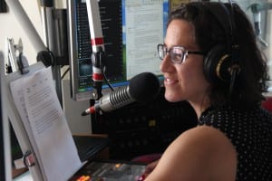 Emily Forman delivers the evening news. (KCAW photo/Rachel Waldholz)