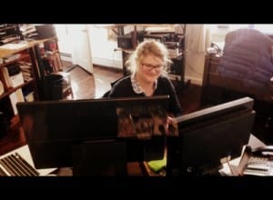 KCAW summer news intern Greta "Buzzsaw" Mart hard at work on her last day. (KCAW photo/Robert Woolsey)