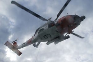 An Air Station Sitka helicopter trains over Gastineau Channel in Juneau in 2008. (Coast Guard News photo)