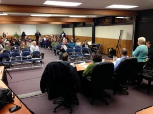 Municipal attorney Robin Koutchak (far left) speaks as the audience gathers for Sitka's Marijuna Town Hall. "How far do we want to go," she asked. "Do we want police to say 'Drop the brownie'?" (KCAW photo/Robert Woolsey)