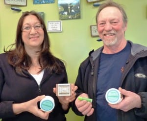 Devil's Club Wintersong owners Ruth and Gary McMaster - compressed Wintersong owners Ruth and Gary McMasters hold their devil’s club salve, lip balm and soap at their Sitka store.