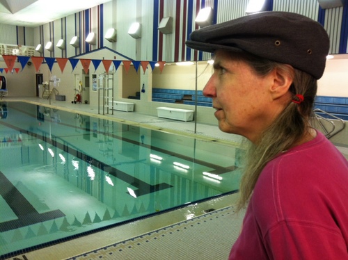 Jane Eidler looks out over the Blatchley Pool on Tuesday morning. Eidler has managed the pool full-time for seven years, and worked at it in some role since 1976. Hers is the second highest job on a list of potential cuts to balance the school district's budget. (KCAW photo by Ed Ronco)