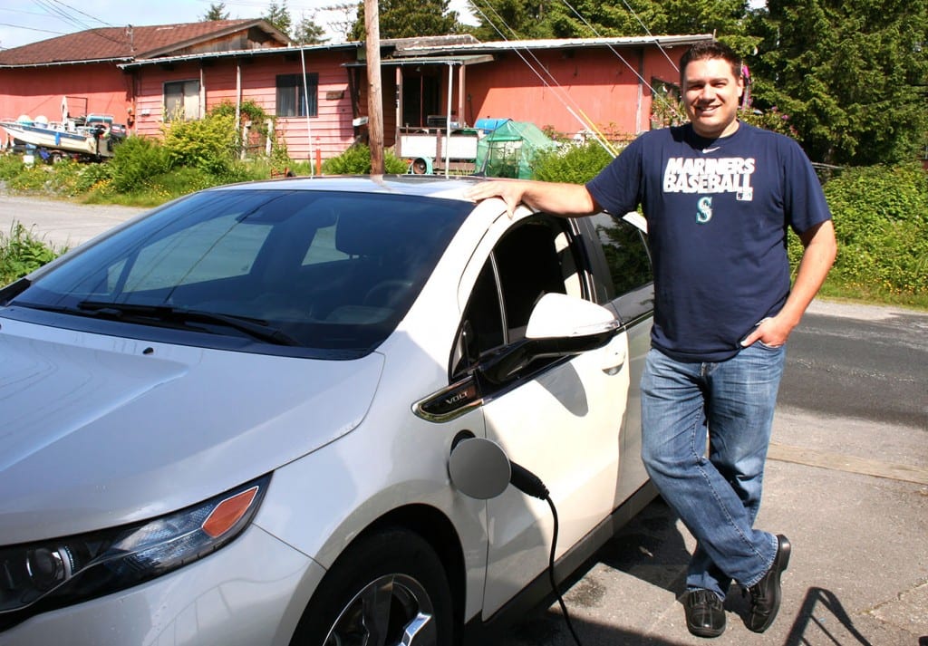 Sitka's lone electric car owner, Michael Mahoney, standing next to his Chevy Volt. (KCAW photo by Erik Neumann)