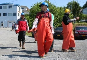 Workers evacuate after an ammonia leak from a boat tied up at Sitka Sound Seafoods. The leak happened at about 11:15 a.m., and was contained shortly afterward. Workers were told to go to lunch and meet back at 1 p.m. in the break room. (KCAW photo by Erik Neumann)