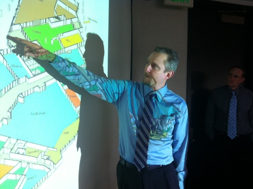 Architect John Weir, of the Anchorage firm McCool Carlson Green, shows the proposed floor plan for Harrigan Centennial Hall in Sitka. The public can weigh in on the plans at a meeting Tuesday inside Centennial Hall. (KCAW photo by Ed Ronco)