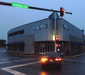 Stereo North's owners object to a new bus site they say will take away customer parking. City officials say it's the safest location.