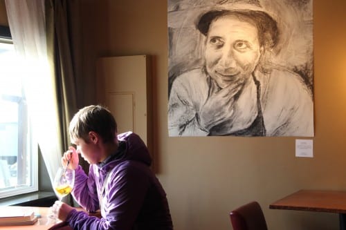 MacNaughton's portraits will be displayed at Rio's Wine Bar in Sitka through the end of May. (KCAW photo/Rachel Waldholz)
