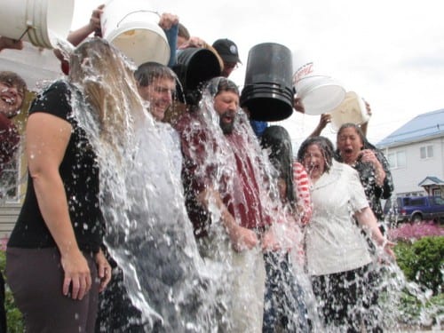 Sitka School Board members Jen Robinson, Tim Fulton, Lon Garrison, Cass Pook, superintendent Mary Wegner, and Tonia Rioux take a dunking for ALS. In turn, the board challenged the Kodiak school board, former Sitka superintendent Steve Bradshaw, and the Sitka Native Education Program. (KCAW photo/Robert Woolsey)