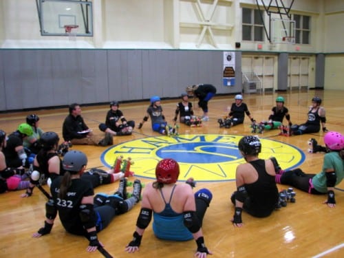 The Slayers have a grueling practice schedule. Two 90-minute practices during the week and one 120-minute practice on the weekend. The team is closely knit and includes coaches, referees. (Emily Kwong/KCAW photo)