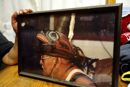 Albert Davis, Herman's older brother, wears the Coho clan hat. The object has been in the family for 300 years. (Emily Kwong/KCAW photo)