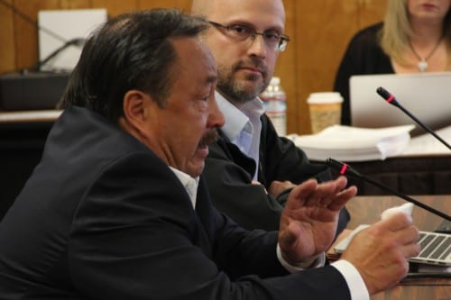 Simeon Swetsov, Jr., left, the mayor of St. Paul in the Pribilof Islands, choked up as he testified before the NPFMC advisory panel. Beside him is Mateo Paz-Soldan. (Rachel Waldholz/KCAW)