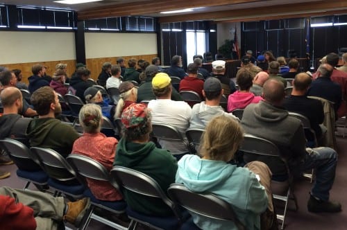 About 70 people gathered in Sitka's Harrigan Centennial Hall to hear from Dale Kelley, of the Alaska Trollers Association. (Rachel Waldholz/KCAW)