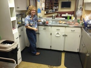Just as an army marches on its stomach, research takes food. Kestrel cook Becky Wilson preps chicken burgers for the D.vex team. (KCAW photo/Robert Woolsey)