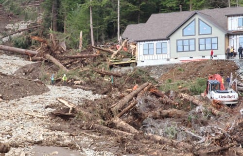 Recovery crews halt work while a trained cadaver dog scents the site where the body of 62-year-old William Stortz was later located. (KCAW photo, Robert Woolsey)