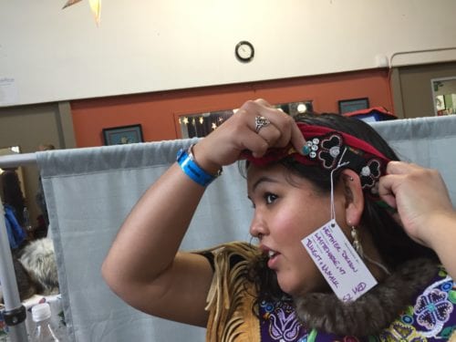 Dickson beads some of her head bands with gold or porcupine quills. After studying fashion in Vancouver, she became interested in the traditional side of sewing and learned from elders. "I picked up a beading needle and haven't been able to put it down since," Dickson said. (Emily Kwong/KCAW photo)