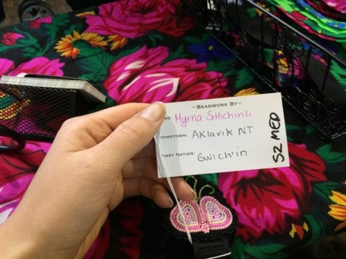To keep up with demand, Dickson commissions other women across the North to help with the beading. Each headband is unique, tagged with the name of the person who made it. This detail is important to her. "There are so many of us and we're all so talented," she said. (Emily Kwong/KCAW photo)